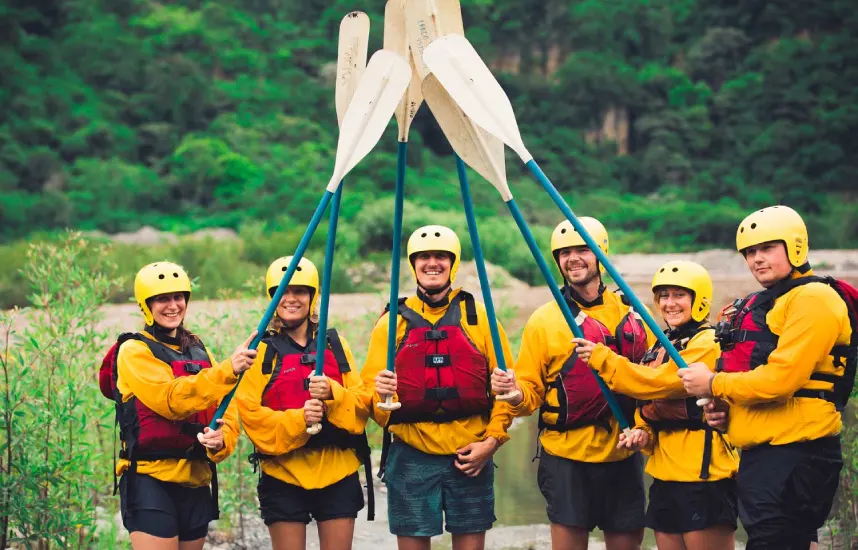 Group of travelers ready for rafting during the Inca Jungle Trek wearing helmets and life jackets in Peru-adventure