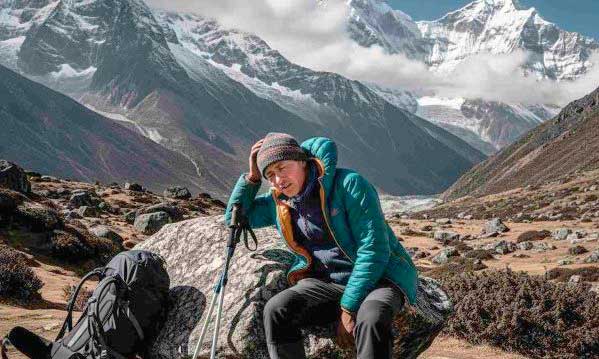 Peru Tours FAQ,Traveler experiencing altitude sickness in Peru at high elevation in the Andes mountains with scenic mountain landscape in the background