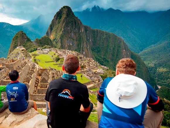 Spectacular view of Machu Picchu in Peru showing ancient Inca citadel, terraces, stone structures, and surrounding cloud forest mountains, Machu Picchu Tours