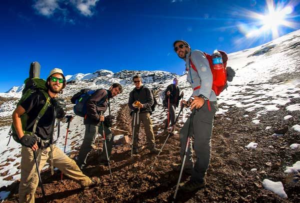 Hiking along the Ausangate Route in Peru with snow-capped peaks, turquoise lakes, glaciers, and high-altitude Andean landscapes