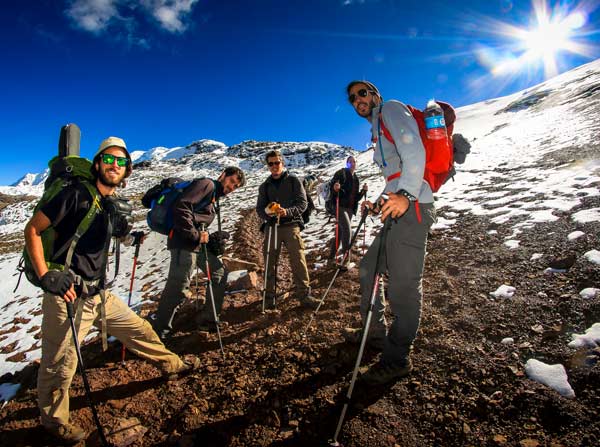 Hiking along the Ausangate Route in Peru with snow-capped peaks, turquoise lakes, glaciers, and high-altitude Andean landscapes