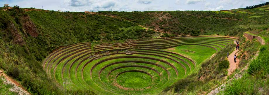 Moray archaeological site in Peru showing circular Inca agricultural terraces surrounded by Andean mountain landscape in the Sacred Valley