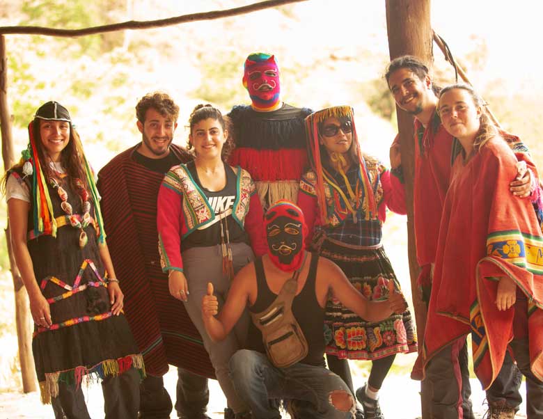 People enjoying a tour in Peru with travelers hiking in the Andes, exploring Inca sites, and experiencing scenic landscapes and local culture