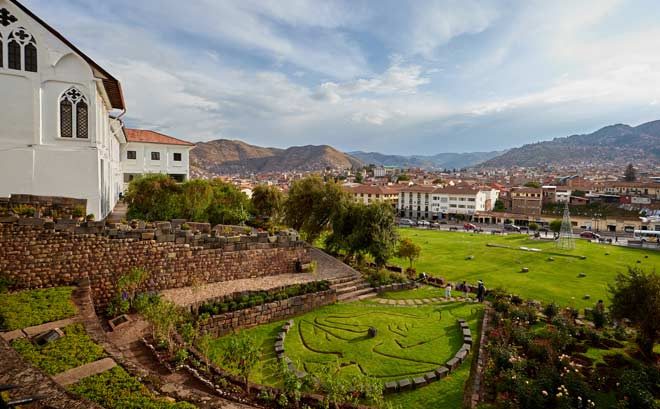 Inti Raymi Cusco, Scenic view of Coricancha in Cusco Peru showing ancient Inca stone walls combined with colonial Santo Domingo church architecture in the historic center