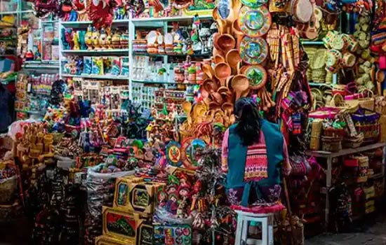 Cusco Markets,Handicraft stalls at San Pedro Market in Cusco displaying colorful textiles, alpaca products, ceramics, and handmade souvenirs.