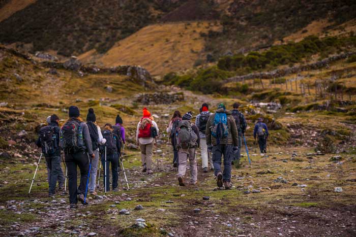 Hikers making their way through dramatic Andean landscapes on the Salkantay Trek.
