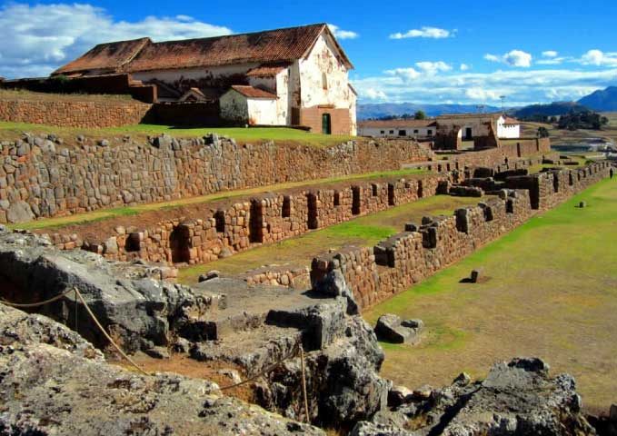 Inca ruins at Chinchero in Peru with stone terraces, agricultural platforms, and Andes mountain landscape in the Sacred Valley