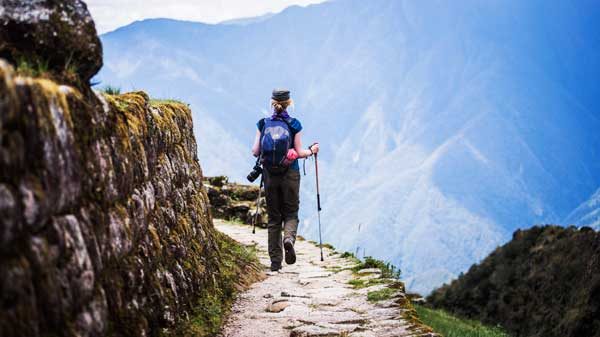 Ancient Inca ruins along the Inca Trail surrounded by cloud forests, stone pathways, and breathtaking mountain scenery on the route to Machu Picchu, Inca Trail Availability 2026