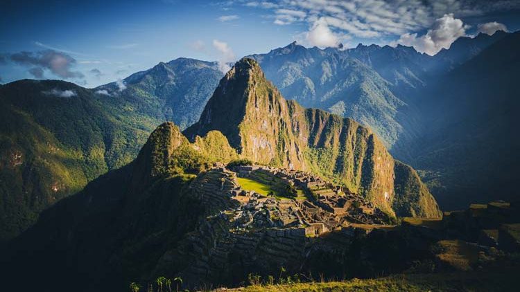 view of machu picchu Huayna Picchu: Incredible Guide,Machu Picchu, the ancient Inca citadel in Peru, surrounded by lush green mountains and dramatic Andean landscapes.