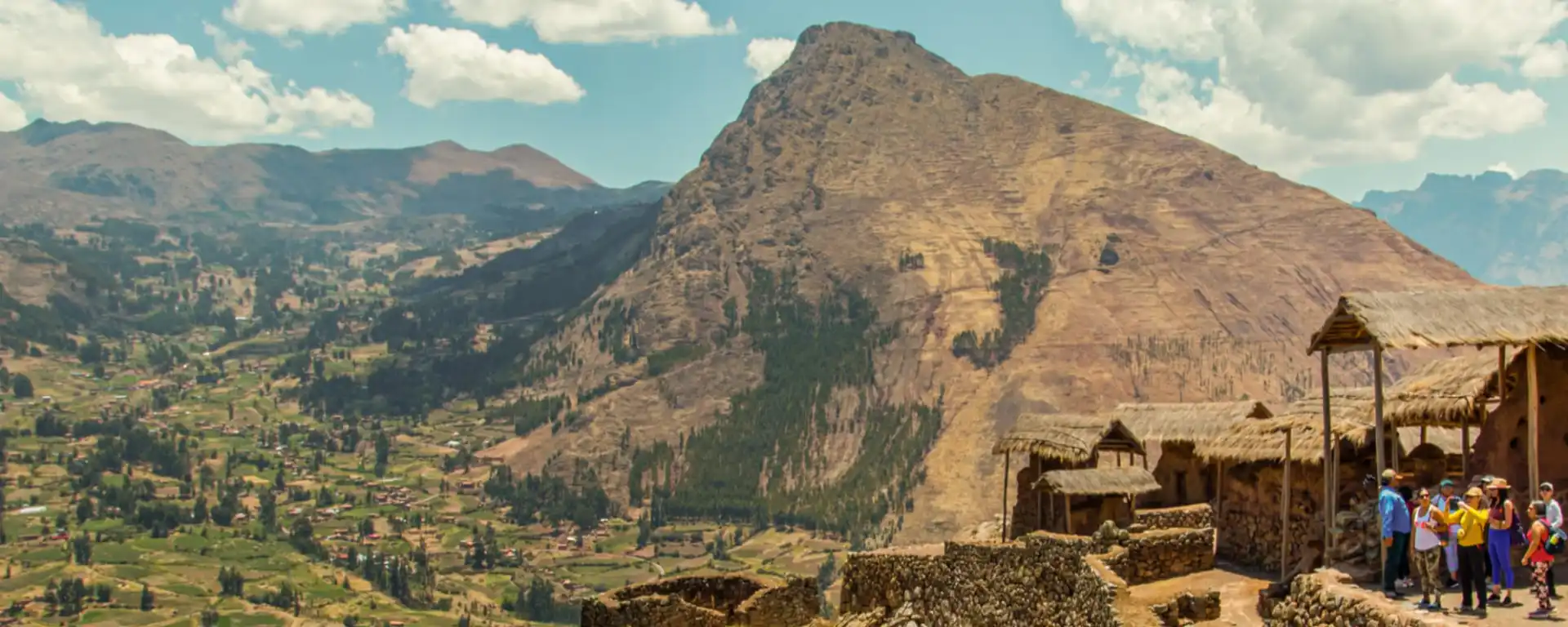 Pisac Travel Guide in the Sacred Valley, Pisac Sacred Valley Peru with Inca terraces, archaeological ruins on the mountainside, and Urubamba River valley landscape