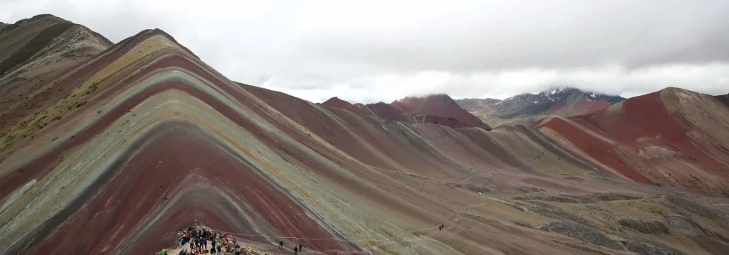 Rainbow Mountain Tour operators from Southern Peru Explorers guiding visitors at Rainbow Mountain in Cusco with colorful landscapes and Andean scenery,
