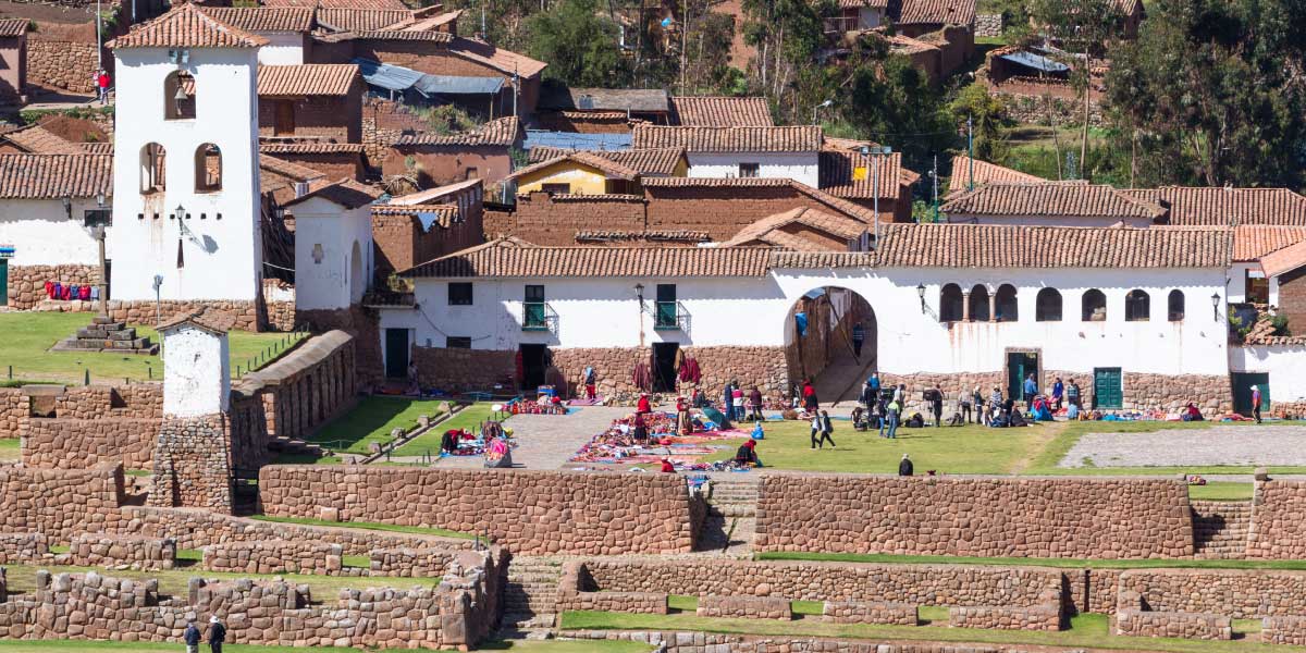 Chincheros Information, Panoramic view of Chinchero in the Sacred Valley of the Incas with Andean mountains, agricultural terraces, and traditional village scenery